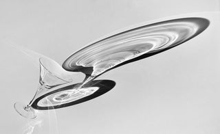 Modern martini glass on a light gray background