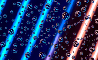 Abstract pattern of striped water droplet spheres on a dark background with blue and orange light effects.