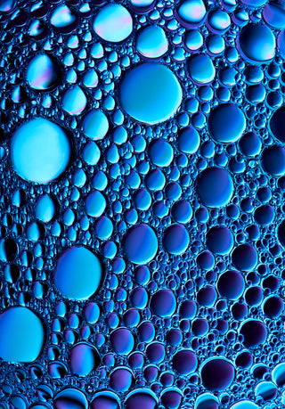 Close-up of blue bubbles on a blue background