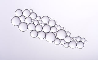 Bubbles of various sizes on a white background