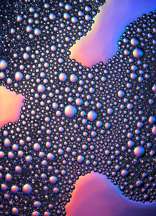 Close-up of colorful bubbles on a gradient background