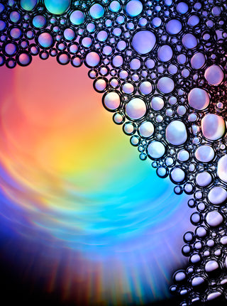 Colorful bubbles with a rainbow gradient background